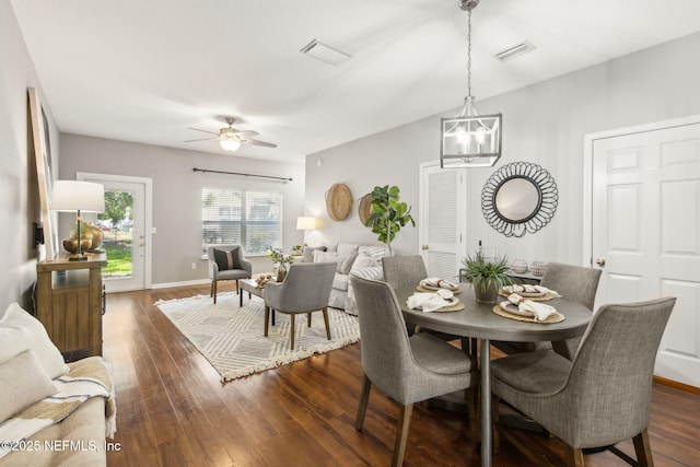542 Southbranch Dr, Saint Johns, FL 32259 - dining space featuring visible vents, baseboards, ceiling fan with notable chandelier, and dark wood-style floors
