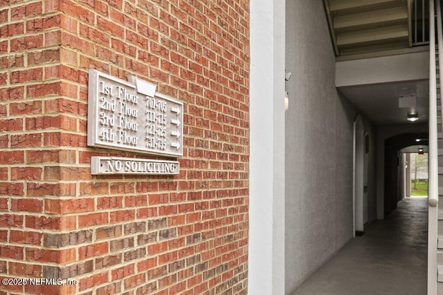 details featuring brick siding and arched walkways