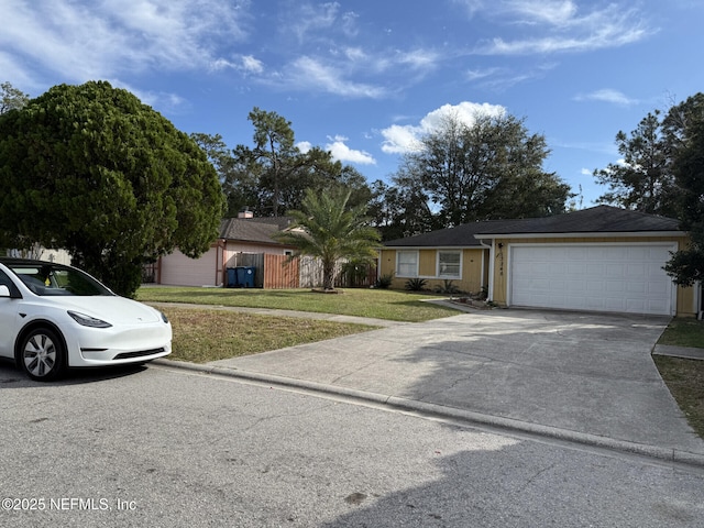 13248 Grant Logan Ln, Jacksonville, FL 32225 - single story home with driveway, a garage, and a front yard