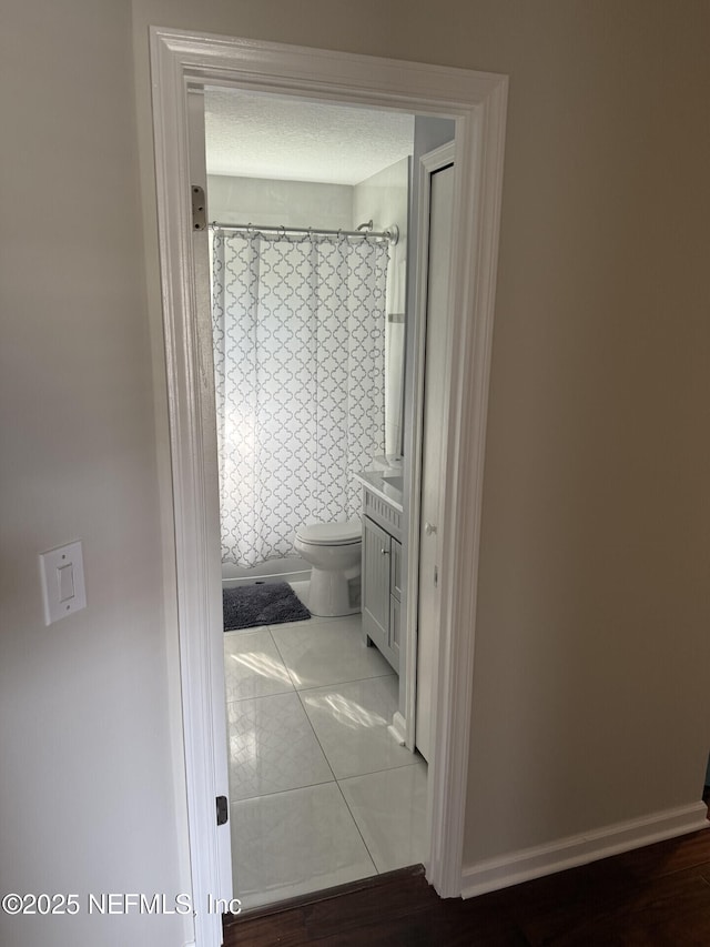 13248 Grant Logan Ln, Jacksonville, FL 32225 - hall featuring baseboards and tile patterned flooring