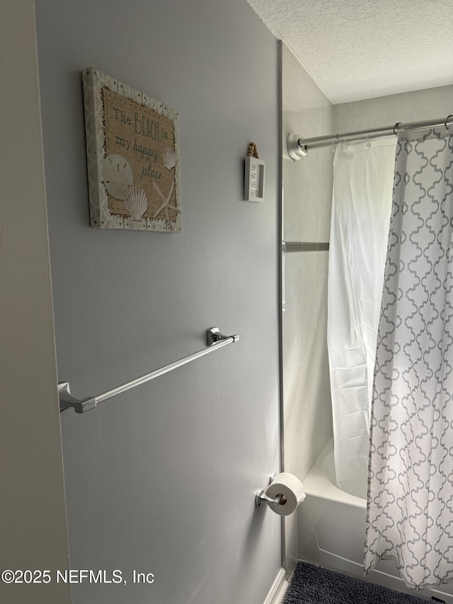 13248 Grant Logan Ln, Jacksonville, FL 32225 - full bathroom featuring a textured ceiling and shower / bath combo with shower curtain