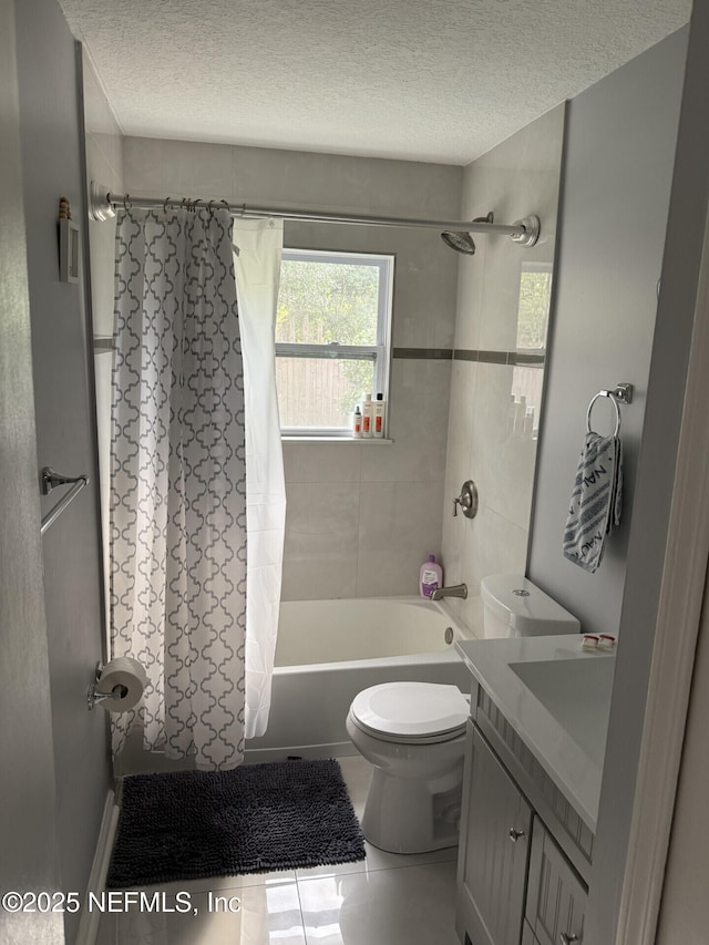 13248 Grant Logan Ln, Jacksonville, FL 32225 - bathroom featuring a textured ceiling, toilet, tile patterned floors, vanity, and shower / tub combo