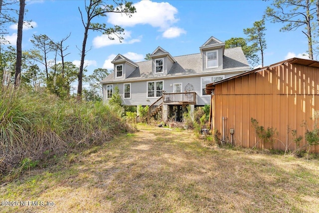 94245 Palm Cir W, Fernandina Beach, FL 32034 - rear view of house with a lawn, stairs, and a wooden deck