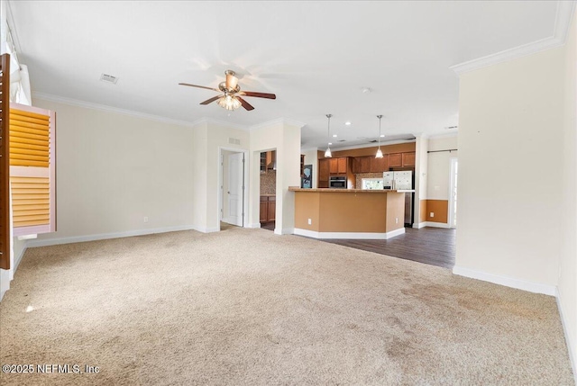 94245 Palm Cir W, Fernandina Beach, FL 32034 - unfurnished living room with baseboards, crown molding, a ceiling fan, and dark colored carpet