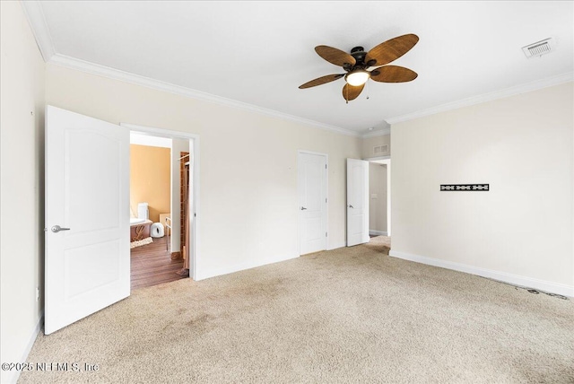 94245 Palm Cir W, Fernandina Beach, FL 32034 - unfurnished bedroom featuring crown molding, carpet floors, a ceiling fan, baseboards, and visible vents