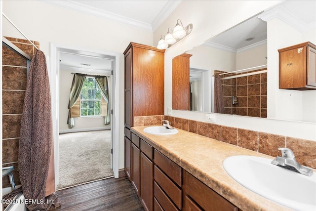 94245 Palm Cir W, Fernandina Beach, FL 32034 - bathroom with double vanity, ornamental molding, a sink, and tiled shower