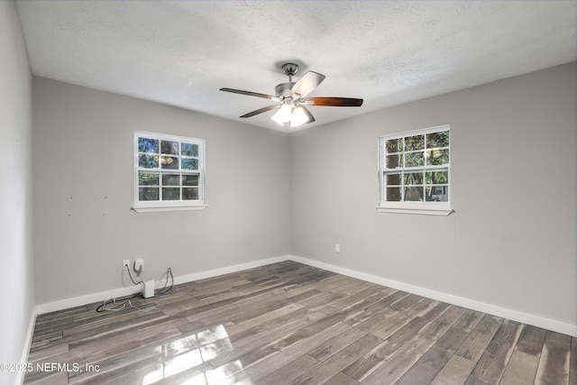 6013 Edgefield Dr, Jacksonville, FL 32205 - spare room with a ceiling fan, a textured ceiling, baseboards, and wood finished floors