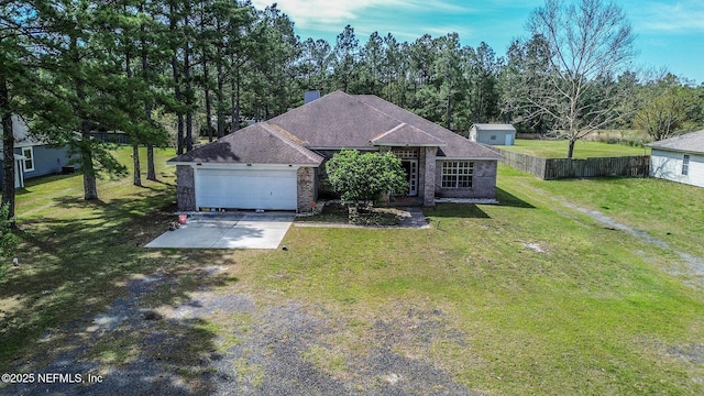 9587 Ford Rd, Bryceville, FL 32009 - view of front of house with an attached garage, a front yard, brick siding, roof with shingles, and driveway