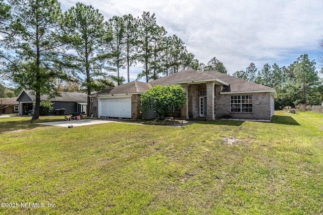 9587 Ford Rd, Bryceville, FL 32009 - view of front of property featuring driveway, a front yard, an attached garage, and brick siding