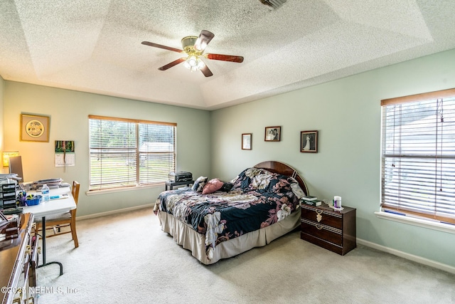 9587 Ford Rd, Bryceville, FL 32009 - bedroom with a tray ceiling, light colored carpet, and baseboards
