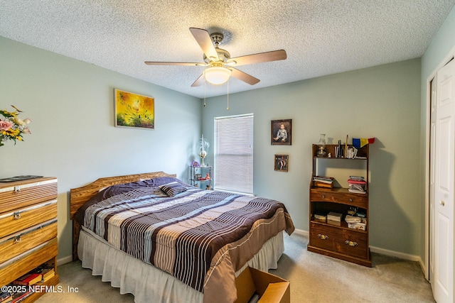 9587 Ford Rd, Bryceville, FL 32009 - carpeted bedroom featuring baseboards, a textured ceiling, and ceiling fan