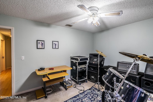 9587 Ford Rd, Bryceville, FL 32009 - playroom with a textured ceiling, baseboards, ceiling fan, and visible vents