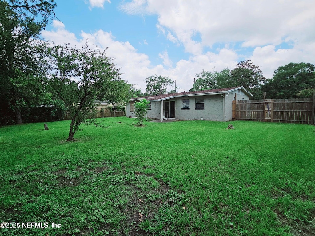 9419 Scadlocke Rd, Jacksonville, FL 32208 - view of yard featuring a fenced backyard