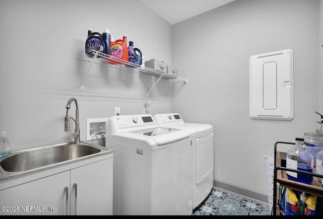 1021 Oakland Hills Ave, Middleburg, FL 32068 - laundry area featuring independent washer and dryer, baseboards, a sink, cabinet space, and electric panel