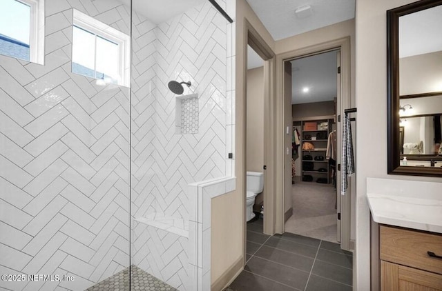 1021 Oakland Hills Ave, Middleburg, FL 32068 - bathroom featuring a stall shower, tile patterned floors, toilet, and vanity