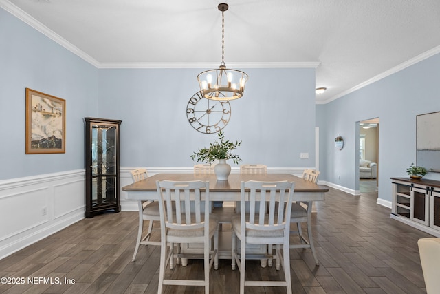 116 Providence Dr, Saint Augustine, FL 32092 - dining room featuring dark wood-style floors, ornamental molding, and a chandelier