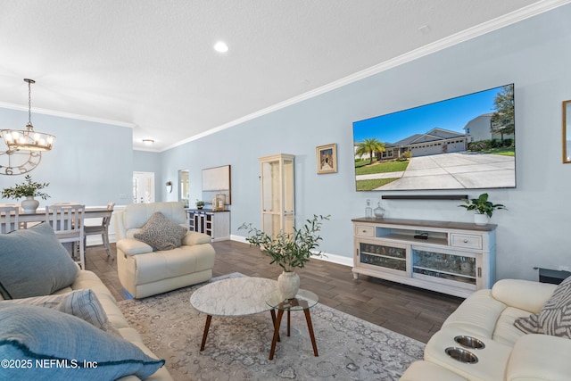 116 Providence Dr, Saint Augustine, FL 32092 - living area featuring a chandelier, wood finished floors, a textured ceiling, baseboards, and ornamental molding