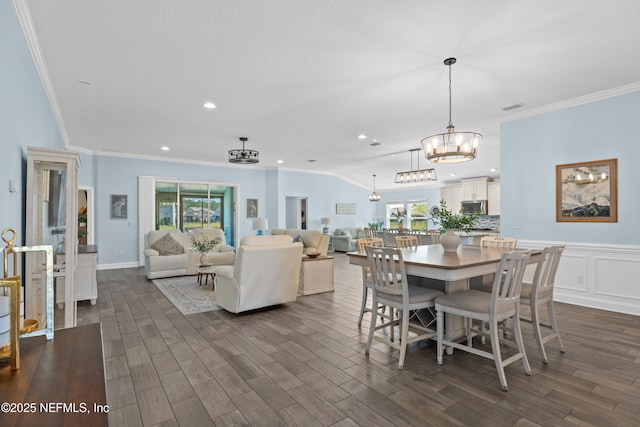 116 Providence Dr, Saint Augustine, FL 32092 - dining space with ornamental molding, a notable chandelier, dark wood-type flooring, and visible vents