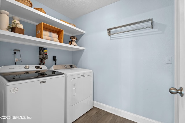 116 Providence Dr, Saint Augustine, FL 32092 - laundry area featuring washing machine and dryer, a textured ceiling, laundry area, baseboards, and dark wood-style flooring
