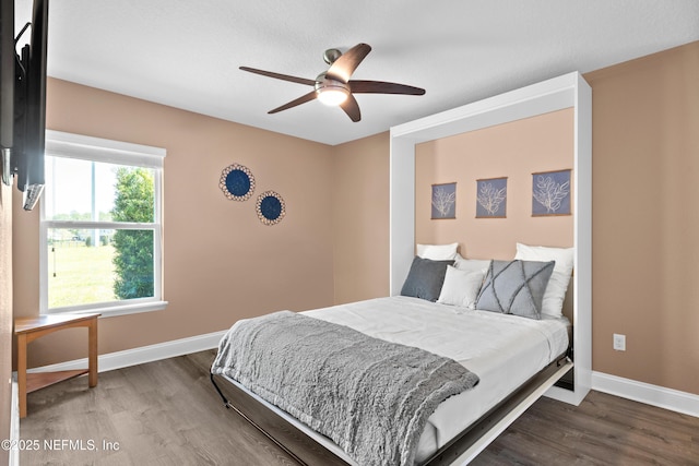 116 Providence Dr, Saint Augustine, FL 32092 - bedroom featuring dark wood finished floors, baseboards, and ceiling fan