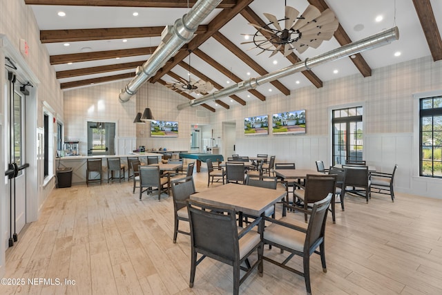 116 Providence Dr, Saint Augustine, FL 32092 - dining room with a wainscoted wall, high vaulted ceiling, beam ceiling, light wood-style flooring, and wallpapered walls