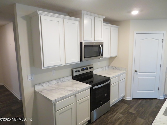 3282 Little Fawn Ln, Green Cove Springs, FL 32043 - kitchen featuring white cabinetry, light countertops, dark wood-style flooring, stainless steel appliances, and baseboards
