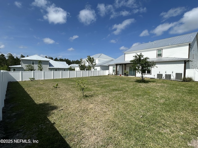 view of yard with cooling unit and a fenced backyard