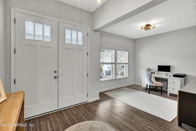 entryway with baseboards and dark wood-style floors