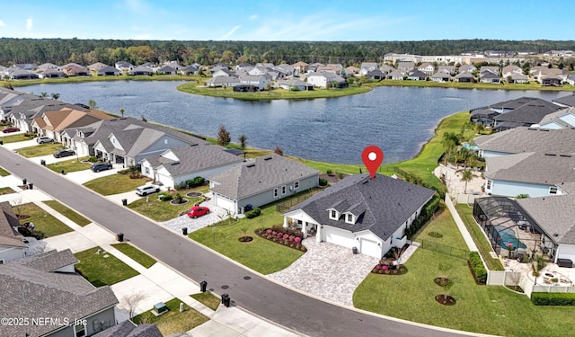 birds eye view of property with a residential view and a water view