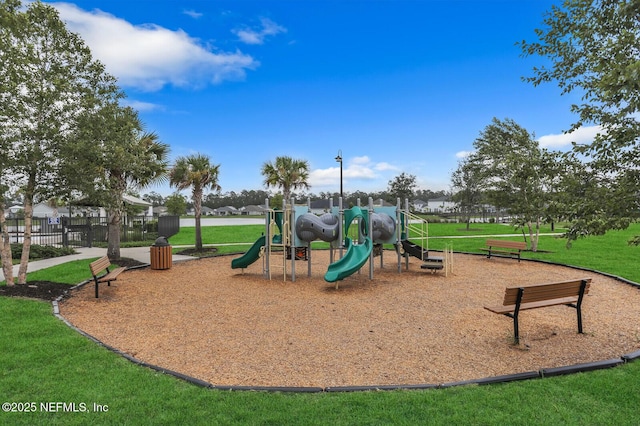 community playground with fence and a lawn