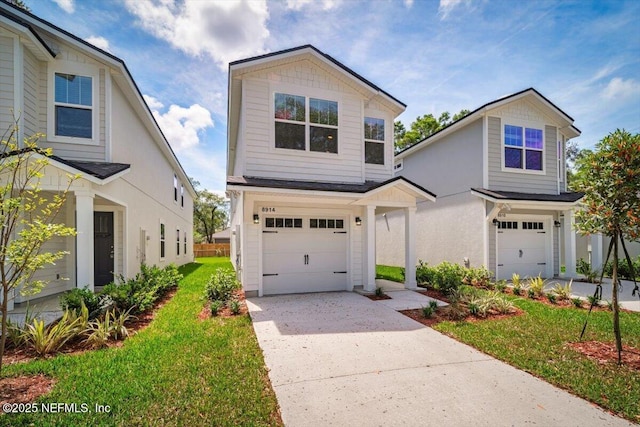 8910 Free Ave, Jacksonville, FL 32211 - traditional-style house with an attached garage, driveway, and a front yard