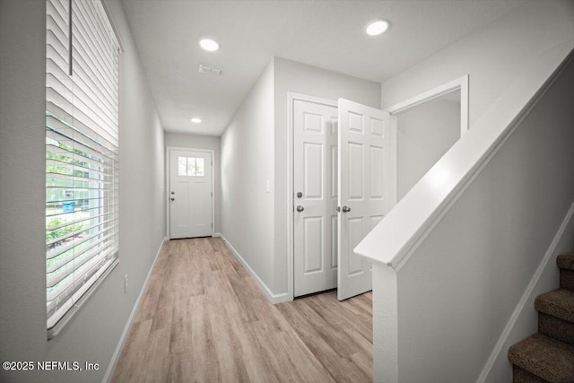 8910 Free Ave, Jacksonville, FL 32211 - entryway with recessed lighting, stairs, light wood finished floors, and baseboards