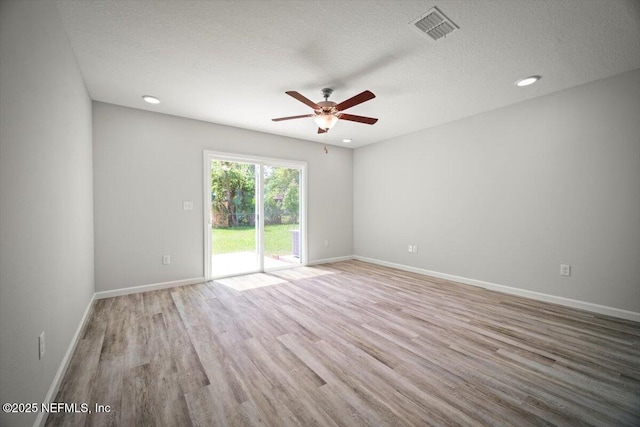 8910 Free Ave, Jacksonville, FL 32211 - spare room with baseboards, a textured ceiling, visible vents, ceiling fan, and wood finished floors