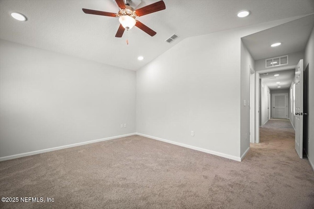 8910 Free Ave, Jacksonville, FL 32211 - carpeted empty room featuring visible vents, baseboards, vaulted ceiling, and ceiling fan