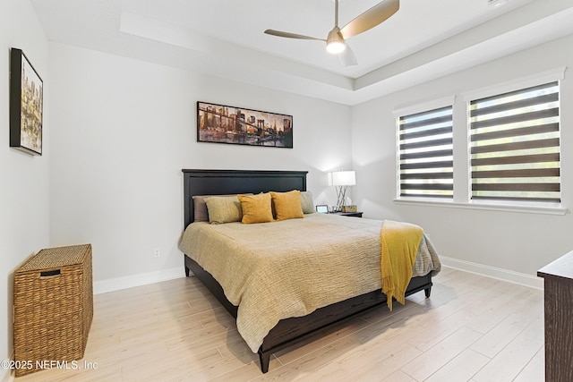212 Fawnwood St, Saint Johns, FL 32259 - bedroom with baseboards, light wood finished floors, and a raised ceiling