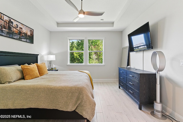212 Fawnwood St, Saint Johns, FL 32259 - bedroom featuring a tray ceiling, baseboards, ceiling fan, and light wood-type flooring