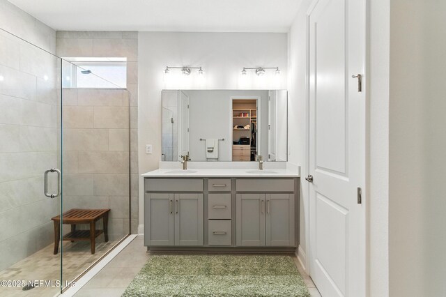 212 Fawnwood St, Saint Johns, FL 32259 - bathroom featuring double vanity, a sink, a walk in closet, and a shower stall