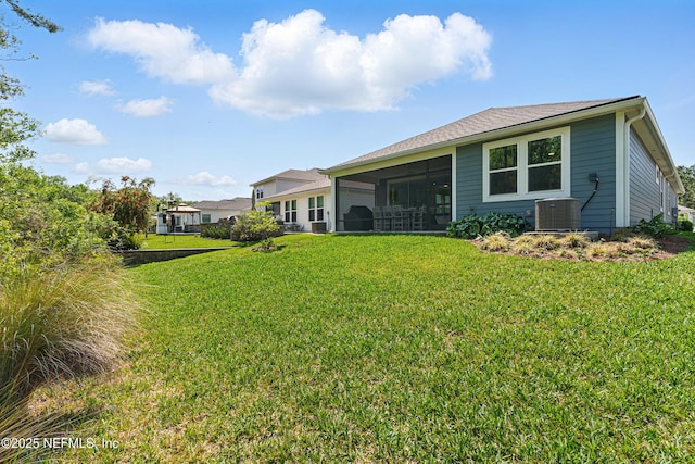212 Fawnwood St, Saint Johns, FL 32259 - back of property with cooling unit, a sunroom, and a lawn