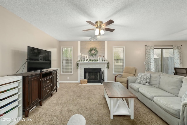 4133 Hidden Branch Dr N, Jacksonville, FL 32257 - living room with light colored carpet, a fireplace with flush hearth, baseboards, a textured ceiling, and ceiling fan