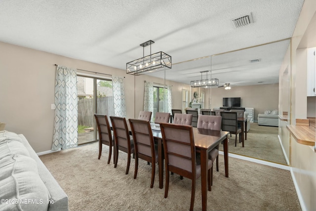 4133 Hidden Branch Dr N, Jacksonville, FL 32257 - carpeted dining room with baseboards, visible vents, and a textured ceiling