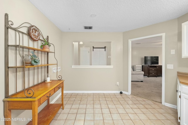 4133 Hidden Branch Dr N, Jacksonville, FL 32257 - corridor featuring light colored carpet, light tile patterned floors, baseboards, a textured ceiling, and visible vents