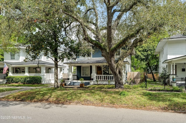2855 Post St, Jacksonville, FL 32205 - view of front facade with roof with shingles, a porch, and fence
