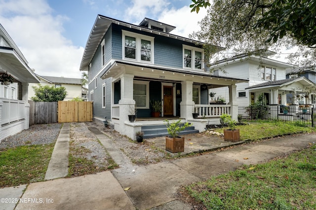 2855 Post St, Jacksonville, FL 32205 - american foursquare style home featuring a gate, fence, and a porch