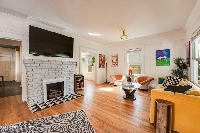 2855 Post St, Jacksonville, FL 32205 - living area featuring a fireplace, wood finished floors, and crown molding