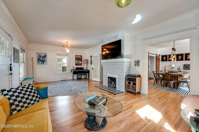 2855 Post St, Jacksonville, FL 32205 - living area featuring a fireplace, ornamental molding, and wood finished floors