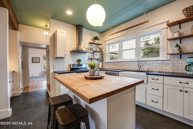 2855 Post St, Jacksonville, FL 32205 - kitchen with wooden counters, exhaust hood, a sink, and open shelves