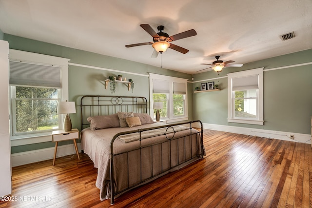 2855 Post St, Jacksonville, FL 32205 - bedroom featuring baseboards, visible vents, a ceiling fan, and hardwood / wood-style floors