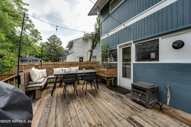 2855 Post St, Jacksonville, FL 32205 - wooden terrace featuring a grill, outdoor dining space, an outdoor hangout area, and fence