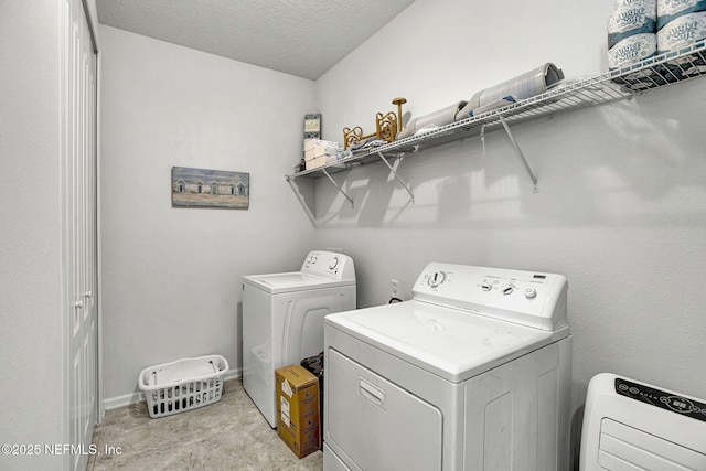 12424 Shady Bridge Trl, Jacksonville, FL 32258 - laundry area with independent washer and dryer, laundry area, and a textured ceiling