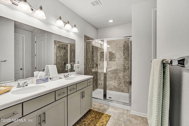 12424 Shady Bridge Trl, Jacksonville, FL 32258 - full bath with a shower stall, double vanity, a sink, and visible vents